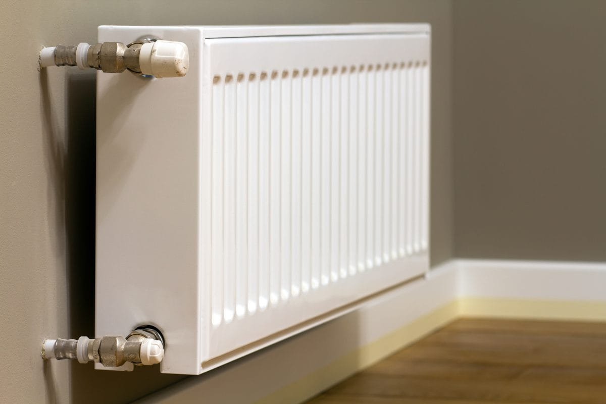 white metal heating radiator gray wall